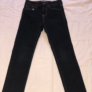 Dark denim blue jeans with brown stitching